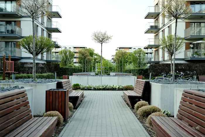 A paved patio with wooden benches